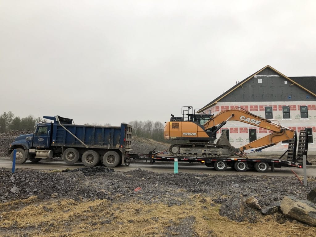 B&K Excavating has a Felling trailer - FT-50-3 LP “Low Profile” deck-over tag trailer with a double incline beavertail with angle iron Air Operated Ramps.