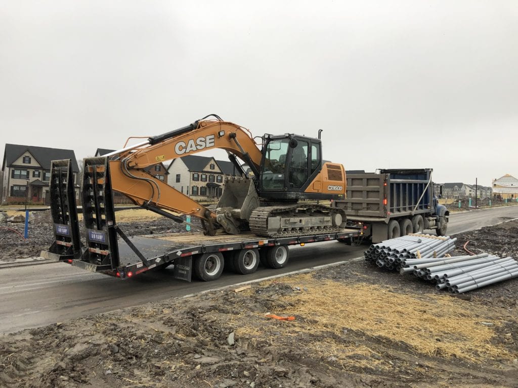 B&K Excavating has a Felling trailer for construction - FT-50-3 LP “Low Profile” deck-over tag trailer with a double incline beavertail with angle iron Air Operated Ramps.