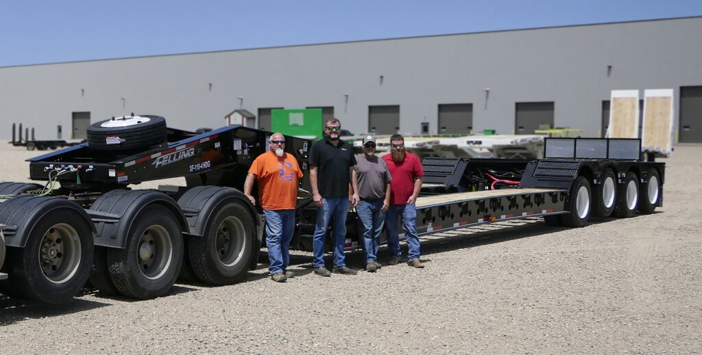 Pictured above: Tom Wagner of GDU, Ed Kinvig of Titan Machinery, Darren Murray of GDU and Jake Meyer, Felling Trailers with the Felling XF-110–4 HDG.