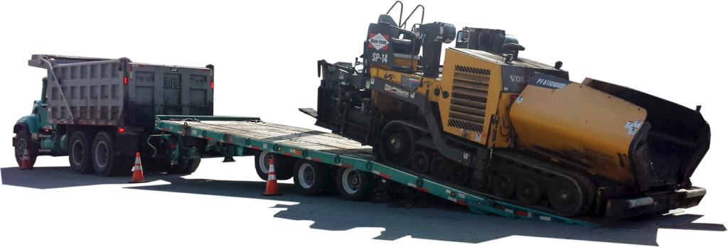 Asphalt paver being loaded onto a Felling Trailers deck-over trailer with air ramps, showing low load angle for paving equipment transport.